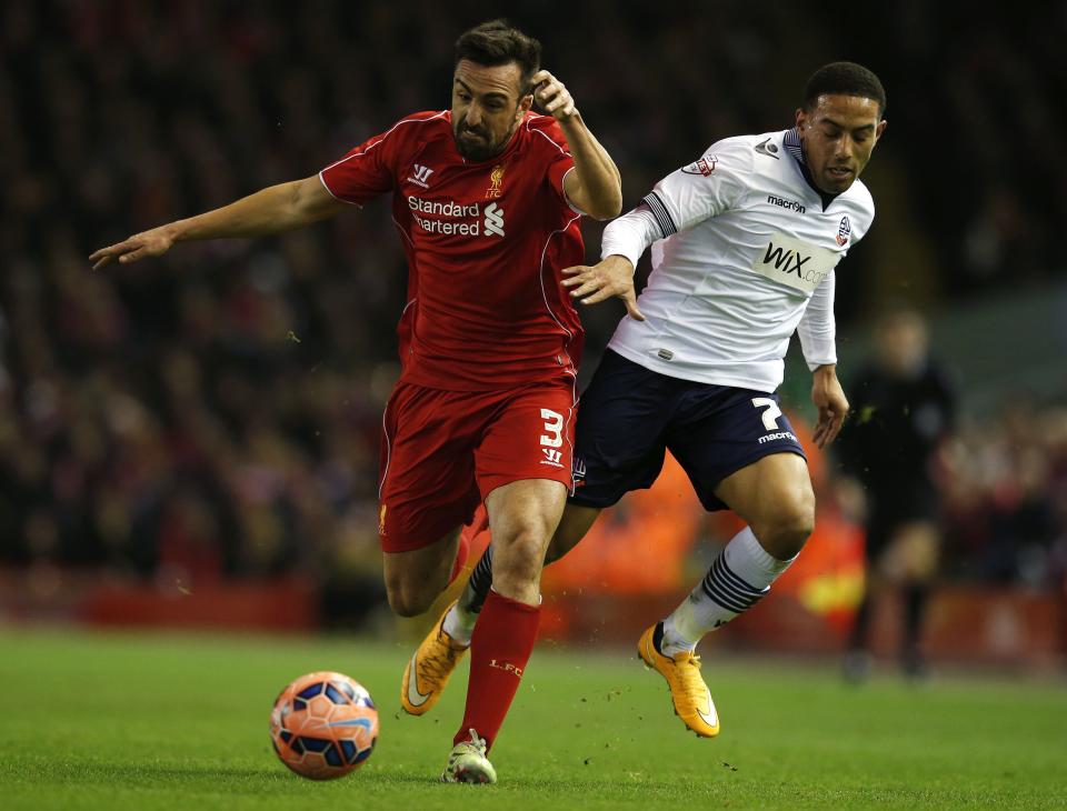 Liverpool's Jose Enrique (L) challenges Bolton Wanderers' Liam Feeney during their FA Cup fourth round soccer match at Anfield in Liverpool, northern England January 24, 2015. REUTERS/Phil Noble (BRITAIN - Tags: SPORT SOCCER)