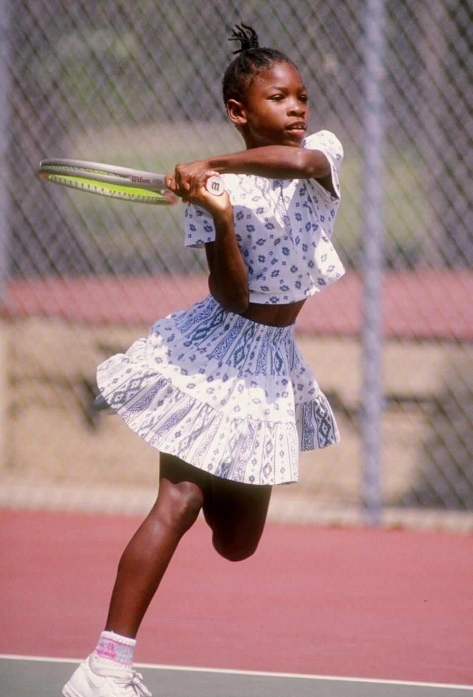 Serena Williams in action on the tennis court.