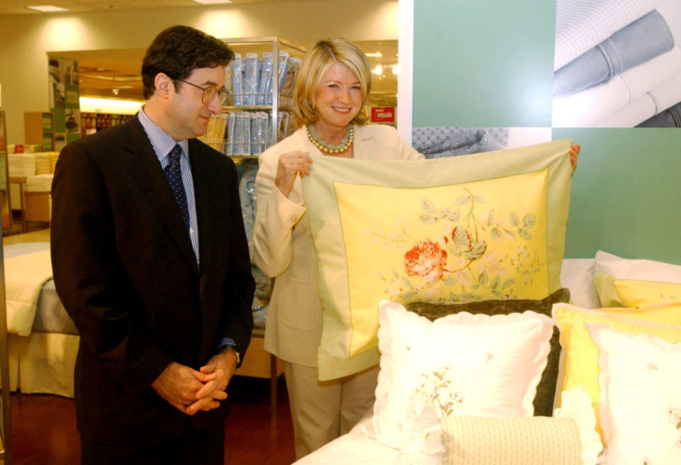 martha stewart holding a pillow with floral prints