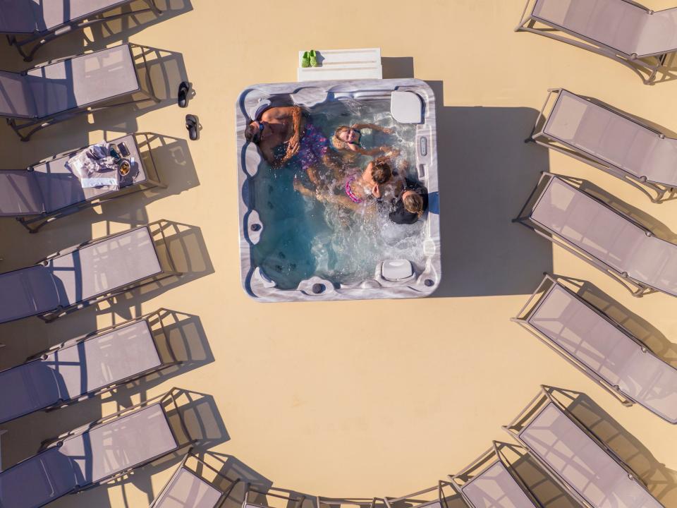 A view of people sitting in the hot tub.