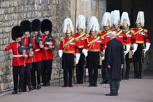 WINDSOR, ENGLAND - SEPTEMBER 19: ,Members of the Coldstream guards and Gentlemen at Arms are seen during the State Funeral of Queen Elizabeth II at Wellington Arch on September 19, 2022 in London, England. Elizabeth Alexandra Mary Windsor was born in Bruton Street, Mayfair, London on 21 April 1926. She married Prince Philip in 1947 and ascended the throne of the United Kingdom and Commonwealth on 6 February 1952 after the death of her Father, King George VI. Queen Elizabeth II died at Balmoral Castle in Scotland on September 8, 2022, and is succeeded by her eldest son, King Charles III.  (Photo by Leon Neal/Getty Images)