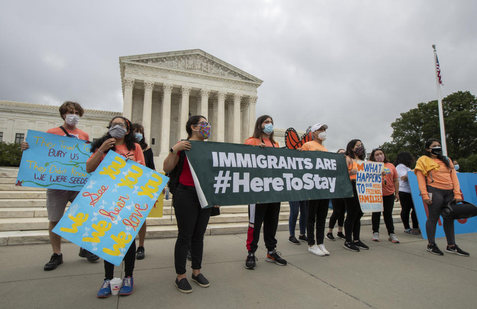 Deferred Action for Childhood Arrivals (DACA) students celebrate in front of the Supreme Court after the Supreme Court rejected President Donald Trump's effort to end legal protections for young immigrants, Thursday, June 18, 2020, in Washington. (Manuel Balce Ceneta/AP Photo)