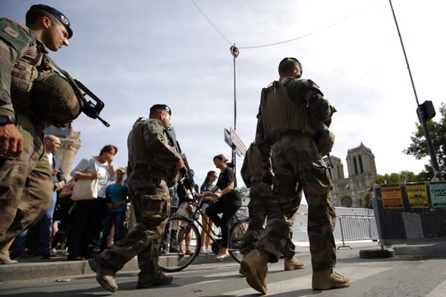 French soldiers patrol around Notre Dame Cathedral