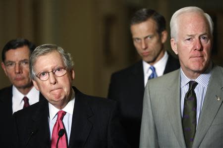 U.S. Senator John Barrasso (R-WY) (L-R), Senate Minority Leader Mitch McConnell (R-KY), Senator John Thune (R-SD) and Senator John Cornyn (R-TX) speak to reporters after their weekly Republican caucus lunch meeting at the U.S. Capitol in Washington, January 14, 2014. REUTERS/Jonathan Ernst