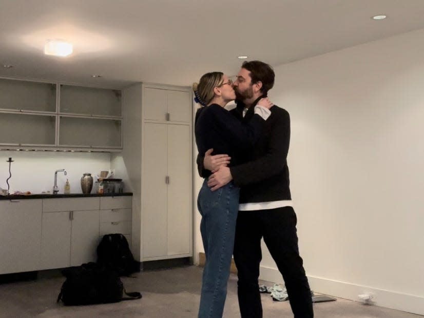 Hayley Folk and her husband in their apartment.