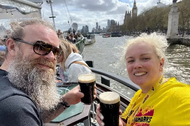 A man and woman drinking beer on a boat