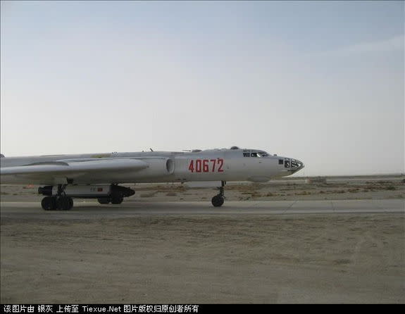 This December 2007 image shows China's robotic Shenlong space plane prototype carried by an H-6 bomber for glide testing.