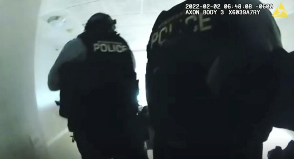 FILE - In this image taken from Minneapolis Police Department body camera video and released by the city of Minneapolis, Minneapolis police enter an apartment on Wednesday, Feb. 2, 2022 moments before shooting 22-year-old Amir Locke. The parents of Amir Locke, who was killed by a Minneapolis police officer when a SWAT team executed a no-knock search warrant one year ago, are suing the city and the officer, Friday, Feb. 3, 2023. (Minneapolis Police Department via AP)