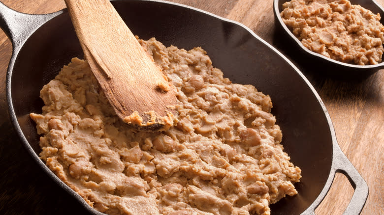 refried beans stirred in a skillet