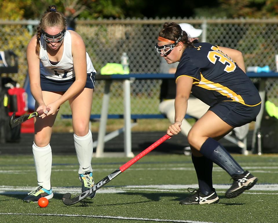 Notre Dame's Avery Engel looks to knock the ball away from Cohasset’s Catherine Brisbane during second quarter action of their game at Cohasset High on Tuesday, Oct. 12, 2021. 