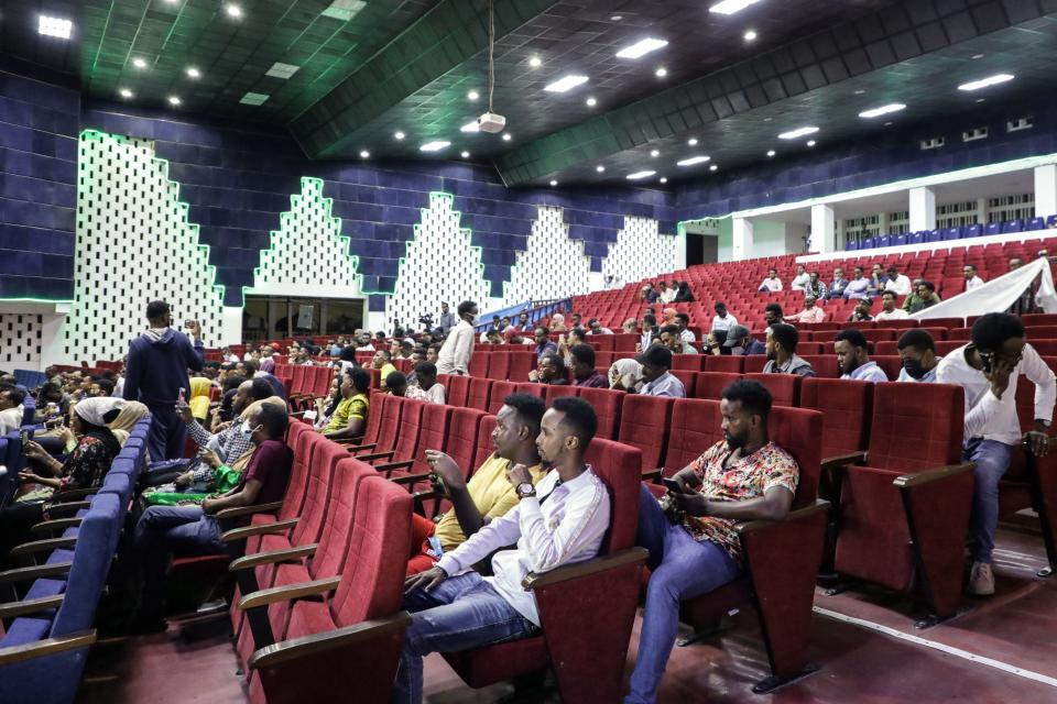 Viewers wait for the first screening of Somali films at The Somali National Theatre in Mogadishu, on September 22, 2021, which has been opened for the first time to public after its inauguration in 2020. / AFP / Abdirahman YUSUF