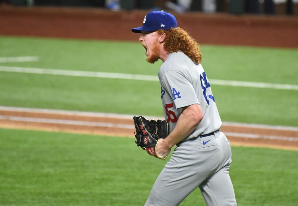 Dodgers pitcher Dustin May reacts after a Joc Pedrson catch during the seventh inning.