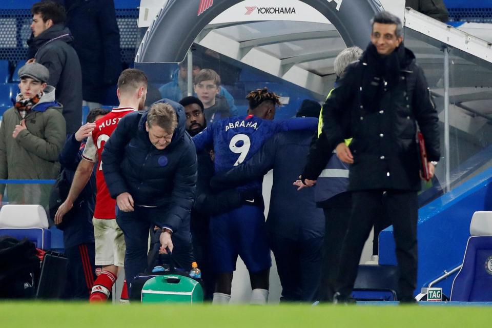 Injury concern: Tammy Abraham is helped down the tunnel at Stamford Bridge (Action Images via Reuters)