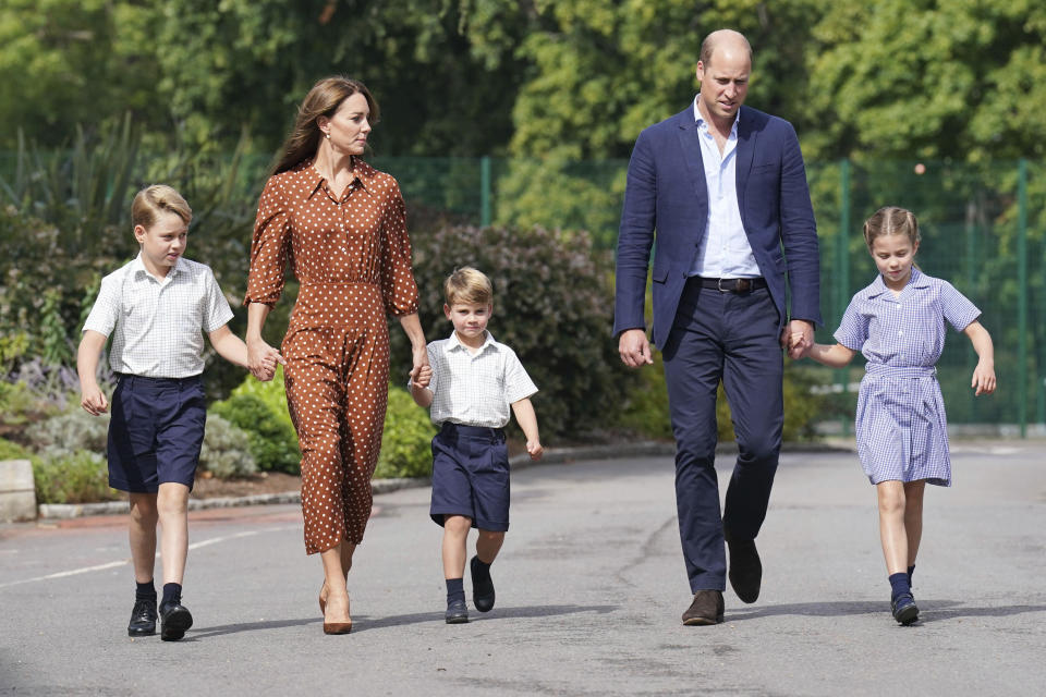 From left, Britain's Prince George, Kate Duchess of Cambridge, Prince Louis, Prince William and Princess Charlotte, arrive for a settling in afternoon at Lambrook School, near Ascot, England, Wednesday, Sept. 7, 2022. The settling in afternoon is an annual event held to welcome new starters and their families to Lambrook and takes place the day before the start of the new school term. (Jonathan Brady/Pool Photo via AP)