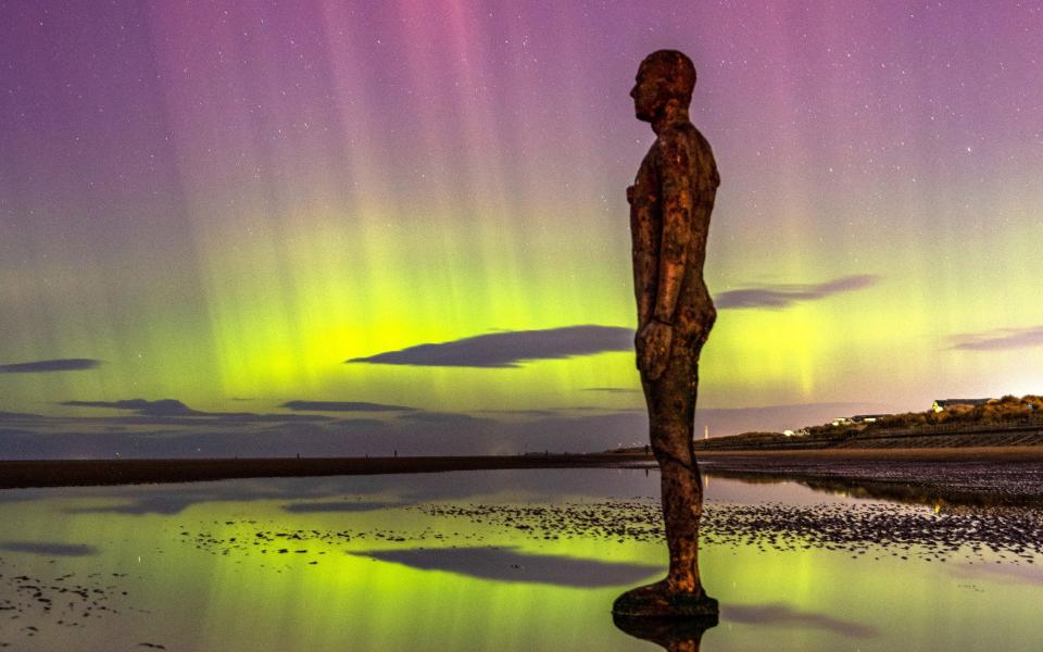 the northern lights at Crosby Beach on the Merseyside coastline