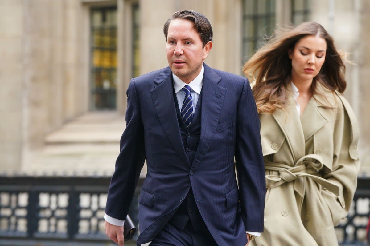 James Stunt arrives with partner Helena Robinson at the Rolls Building in London (Victoria Jones/PA) (PA Wire)