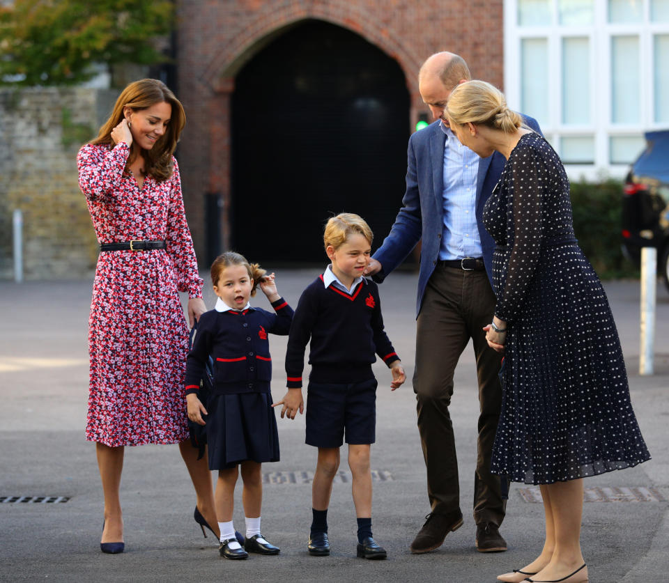 Helen Haslem (right), head of the lower school greets Princess Charlotte as she arrives for her first day of school, with her brother Prince George and her parents the Duke and Duchess of Cambridge, at Thomas's Battersea in London on September 5, 2019 in London, England.