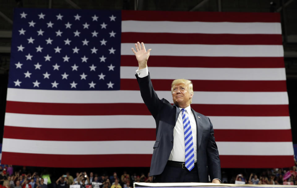 President Donald Trump waves as he arrives to speak during a rally Tuesday, Aug. 21, 2018, in Charleston, W.Va. (AP Photo/Alex Brandon)