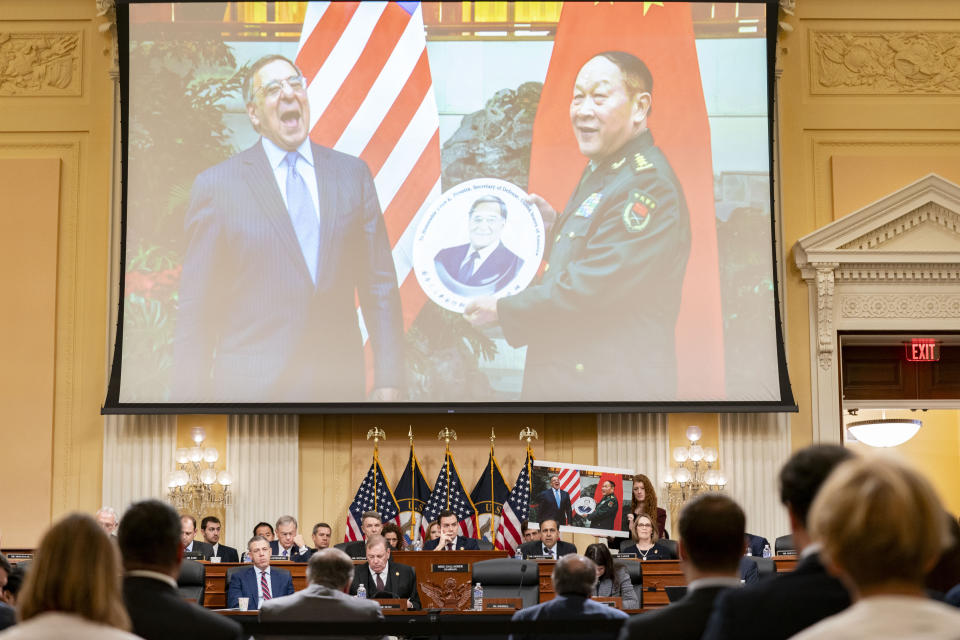 A photo of former Secretary of Defense Leon Panetta receiving a plate as a gift from Chinese Defense Minister Gen. Liang Guanglie in 2012 in Beijing is displayed on a screen during a House Select Committee on the Chinese Communist Party hearing on Chinese government support for American adversaries as committee Ranking Member Rep. Raja Krishnamoorthi, D-Ill., questions witnesses, Tuesday, Jan. 30, 2024, on Capitol Hill in Washington. (AP Photo/Stephanie Scarbrough)