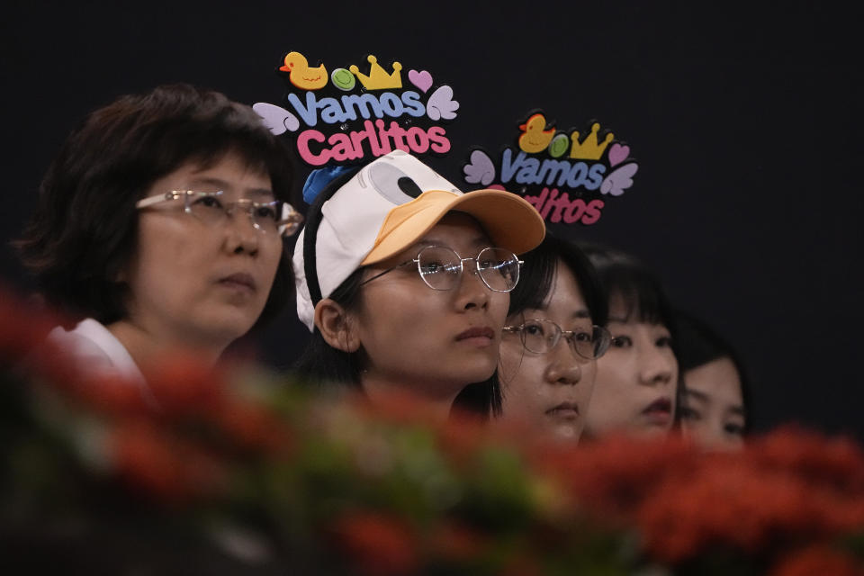 Fans of Carlos Alcaraz of Spain watch Alcaraz plays in the men's singles quarterfinal match against Casper Ruud of Norway in the China Open tennis tournament at the Diamond Court in Beijing, Monday, Oct. 2, 2023. (AP Photo/Andy Wong)