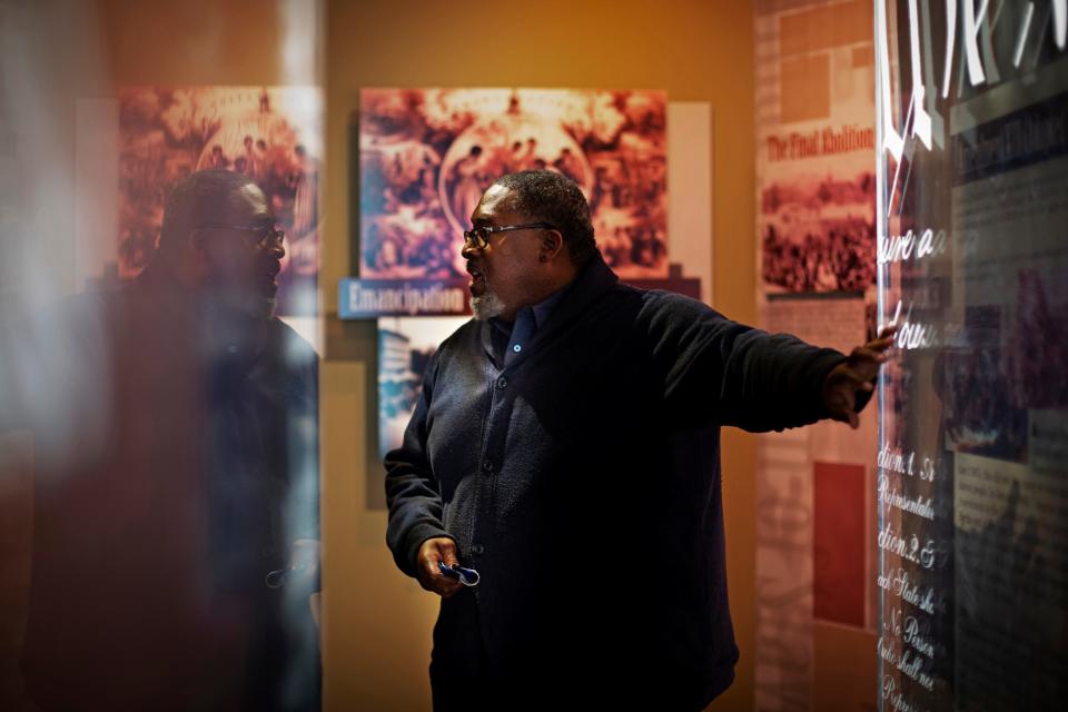 Christopher Miller, senior director of education and community engagement, gives a tour of an exhibit at the National Underground Railroad Freedom Center in downtown Cincinnati on Wednesday, May 25, 2022.