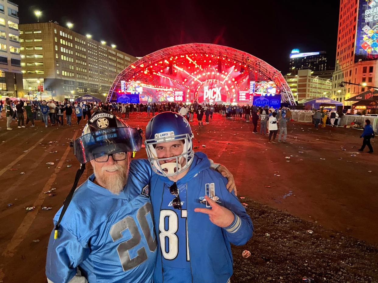 Mark Elker, 62, of Northville, celebrates with his son Jacob, 32, after the Detroit Lions traded up for Alabama cornerback Terrion Arnold in the 2024 NFL Draft