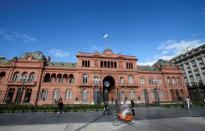 Pedestrians walk past Argentina's Casa Rosada government house, in Buenos Aires, Argentina March 26, 2019. REUTERS/Agustin Marcarian