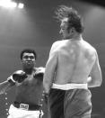 <p>Heavyweight boxer Muhammad Ali hits Chuck Wepner during a heavyweight title fight on March 24, 1975 at the Richfield Coliseum in Richfield, OH. Ali won the bout with a TKO in the 15th round.<br>1975 Paul Tepley Collection/Diamond Images</p>