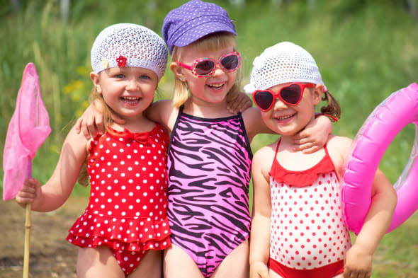 Three little cute girls having good summertime