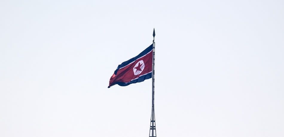 A flag flies from a tower in a propaganda village in North Korea near the Demilitarized Zone (DMZ) between South and North Korea on February 7, 2018 in Panmunjom, South Korea.