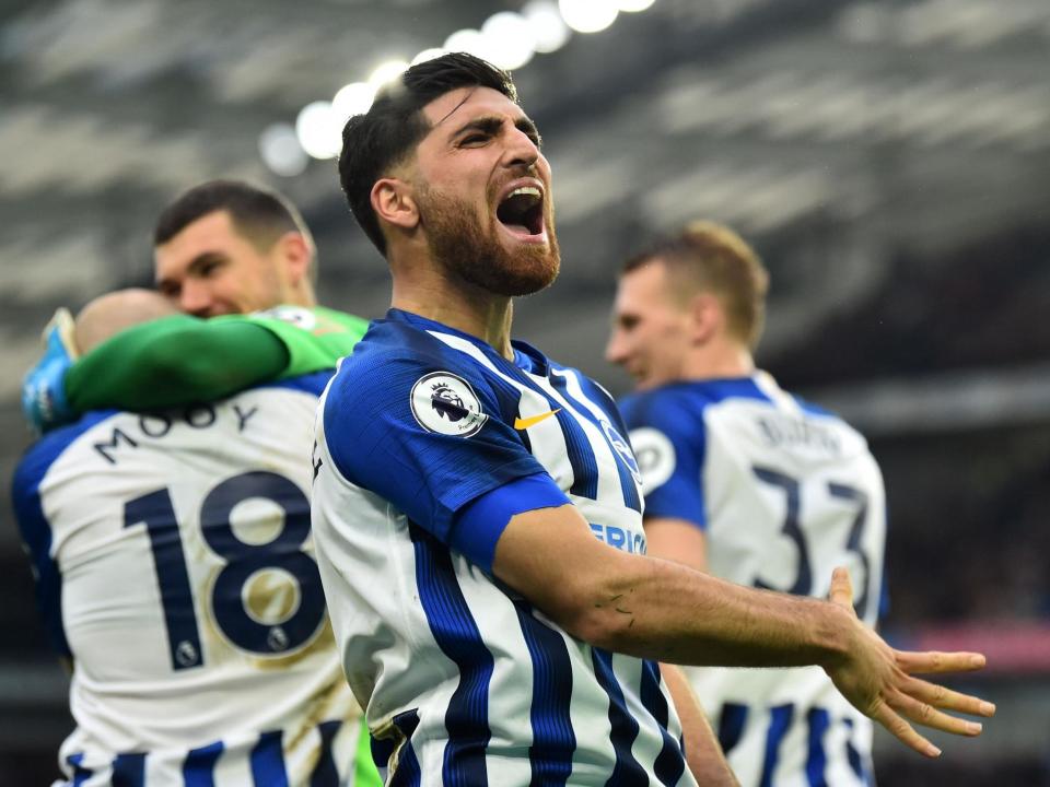 Alireza Jahanbakhsh celebrates after Aaron Mooy scored Brighton's second against Bournemouth: Getty