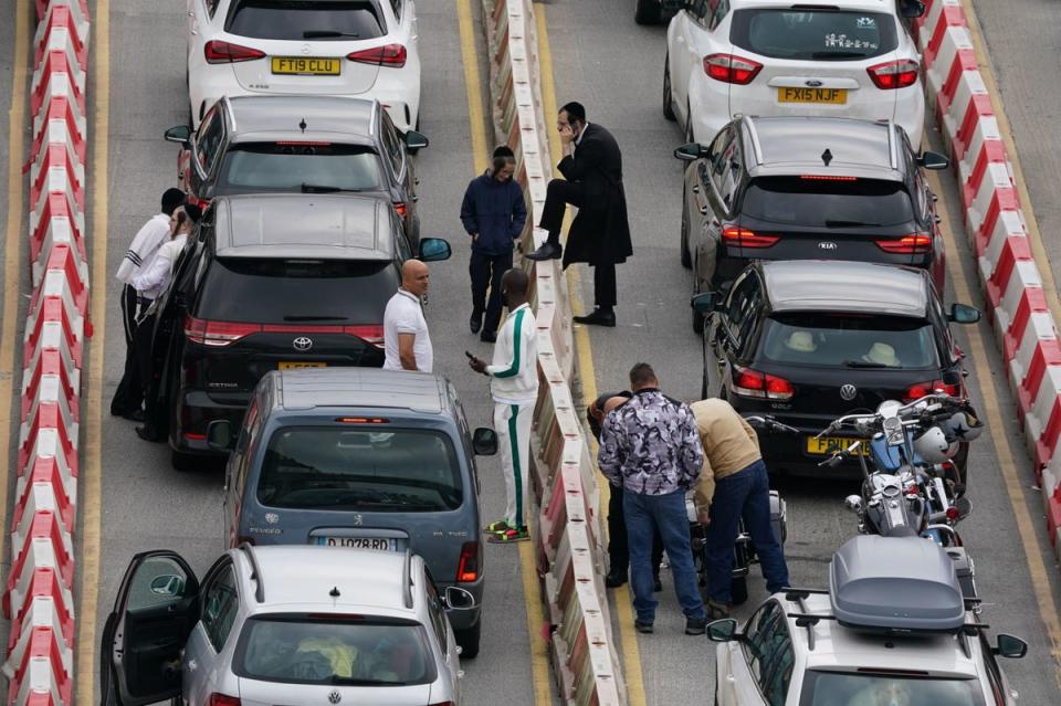 People were seen getting out of their cars as traffic queued on Friday (PA)