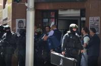 Armed police outside the cafe