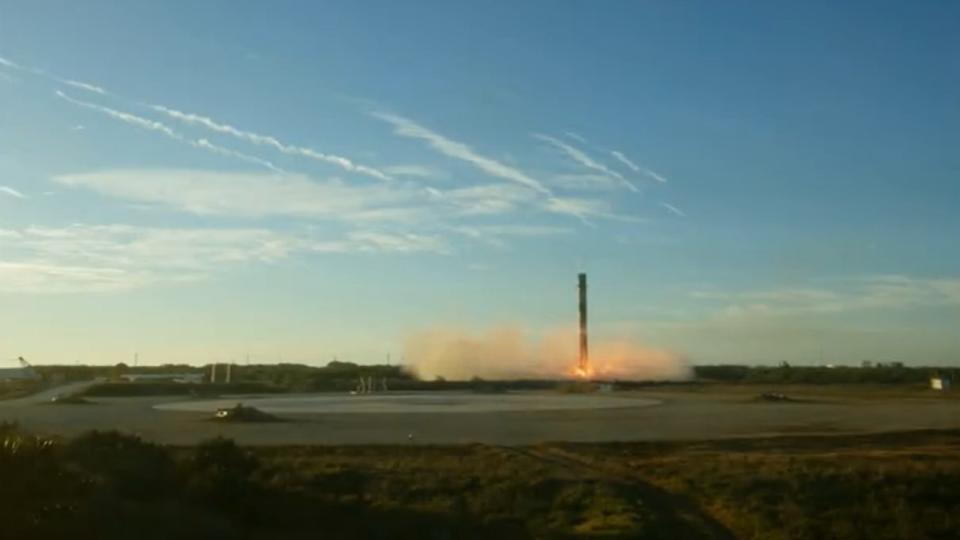 a white rocket flies through the air in a perfectly blue sky