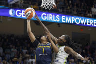 Indiana Fever forward NaLyssa Smith (1) tries to shoot over Dallas Wings forward Natasha Howard (6) during the first half of an WNBA basketball game in Arlington,Texas, Friday, May 3, 2024. (AP Photo/Michael Ainsworth)