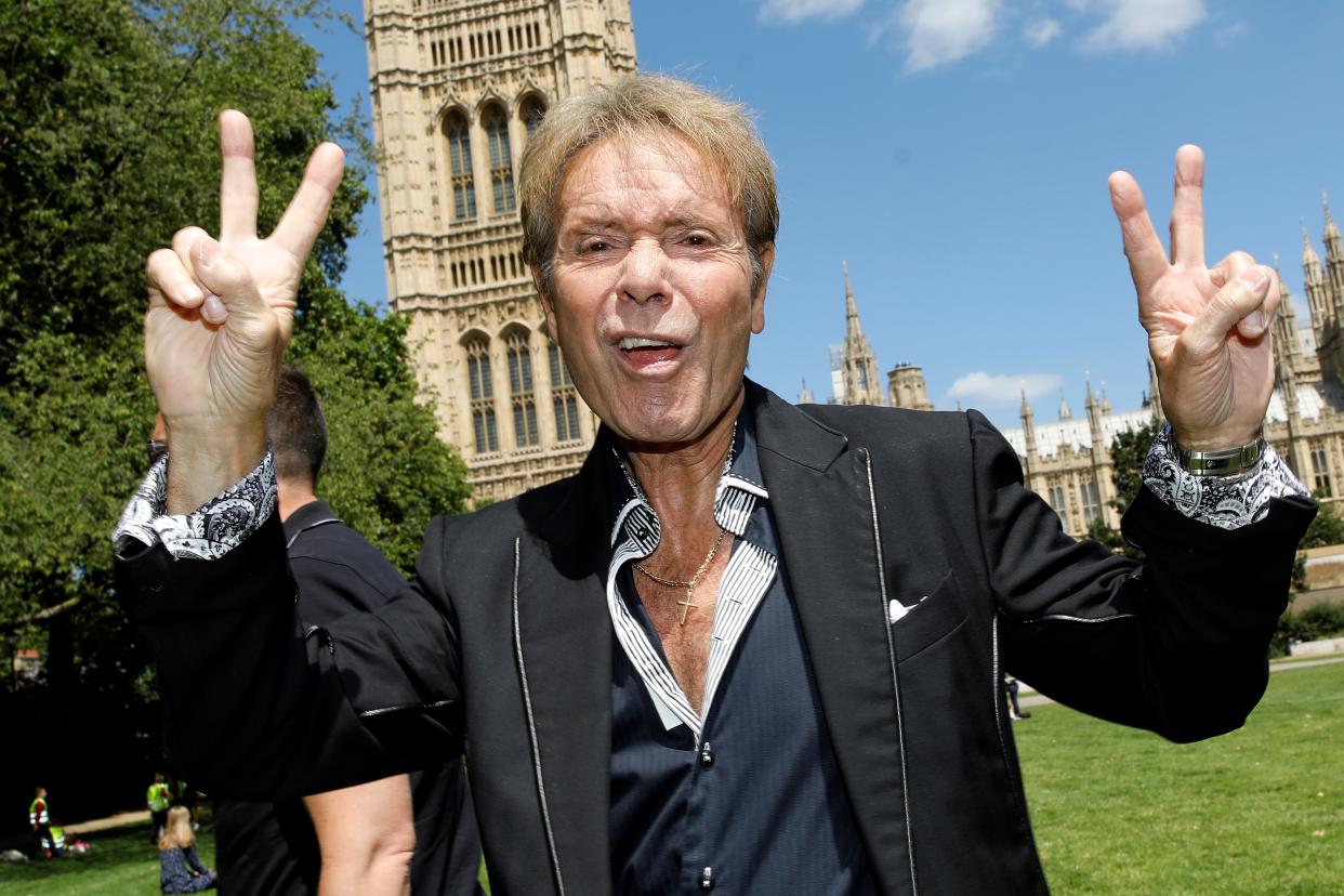 British singer Cliff Richard gestures as he leaves after speaking to members of the media near the Houses of Parliament in London on July 1, 2019. - Singer Cliff Richard, and radio host Paul Gambaccini, announced they will launch a petition in an attempt to change the law to give anonymity to those accused of sexual offences, until they are charged. Richard and Gambaccini were both falsely accused of historical sex offences. (Photo by Tolga AKMEN / AFP) (Photo by TOLGA AKMEN/AFP via Getty Images)