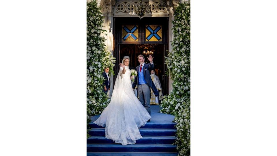 Princess Theodora waving to onlookers with Crown Prince Pavlos