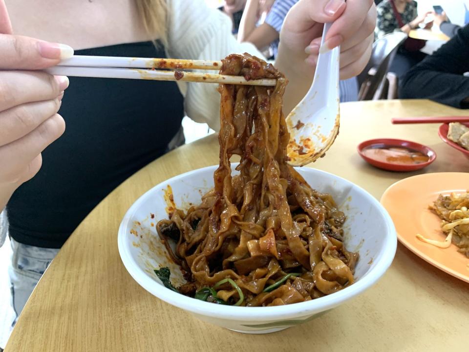 Subang Ria - Noodles lifted with chopsticks