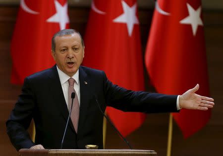 Turkish President Tayyip Erdogan makes a speech during his meeting with mukhtars at the Presidential Palace in Ankara, Turkey, November 26, 2015. REUTERS/Umit Bektas