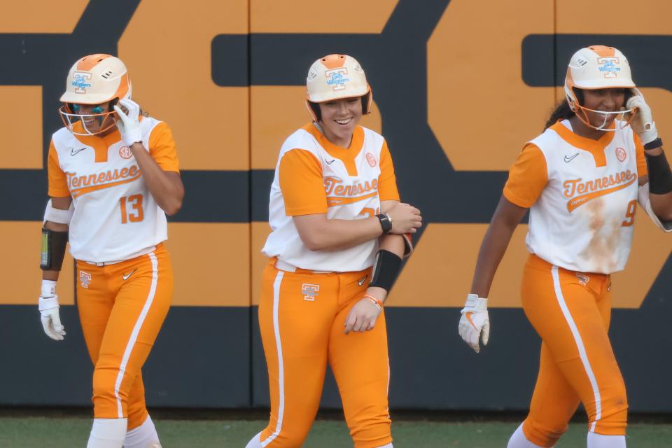 Tennessee outfielder Amanda Ayala (13) and Tennessee infielder McKenna Gibson (24) and Tennessee outfielder Kiki Milloy (9) celebrate a play during the NCAA Regional Softball game against Campbell at the Sherri Parker Lee Stadium in Knoxville, TN on Friday, May 20, 2022.