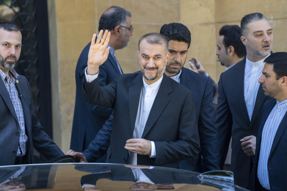 Iranian Foreign Minister Hossein Amirabdollahian waves for cameras after a joint press conference with his Lebanese counterpart Abdallah Bouhabib in Beirut, Lebanon, Thursday, April 27, 2023. (AP Photo/Hassan Ammar)