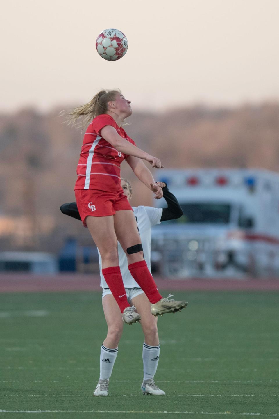 Pueblo Centennial's Kylee Farrer goes up high for a header during a matchup with Pueblo West on Thursday, April 7, 2022 at Dutch Clark Stadium.