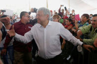 Leftist front-runner Andres Manuel Lopez Obrador of the National Regeneration Movement (MORENA) greets supporters during his campaign rally in Cuautitlan Izcalli, Mexico, April 13, 2018. REUTERS/Henry Romero