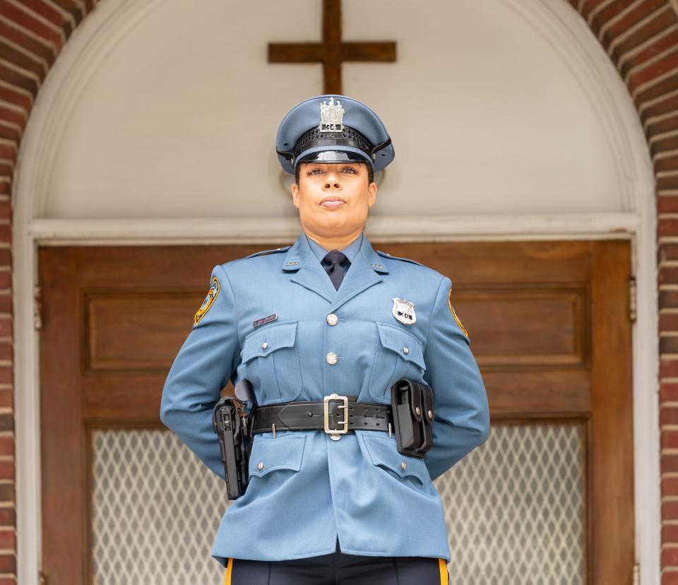 Plainfield Officer Danielle Carvalho stands outside Calvary Baptist Church on Monroe Avenue where she stopped a man armed with a machete during a mental health episode on Palm Sunday 2021.