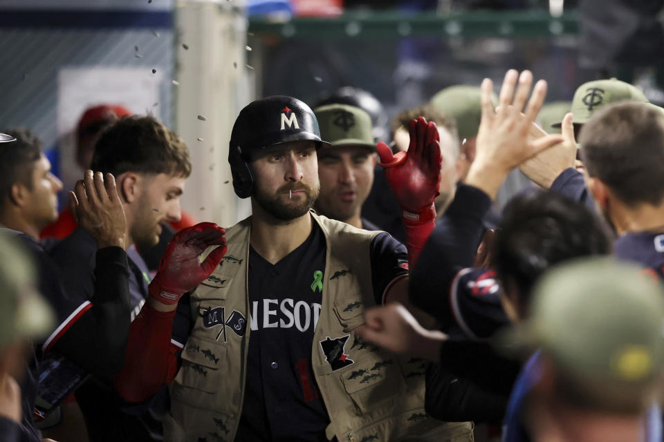 Minnesota Twins first baseman Joey Gallo (13) celebrates with his teammates after hitting a home run during the sixth inning of a baseball game against the Los Angeles Angels in Anaheim, Calif., Saturday, May 20, 2023. (AP Photo/Jessie Alcheh)