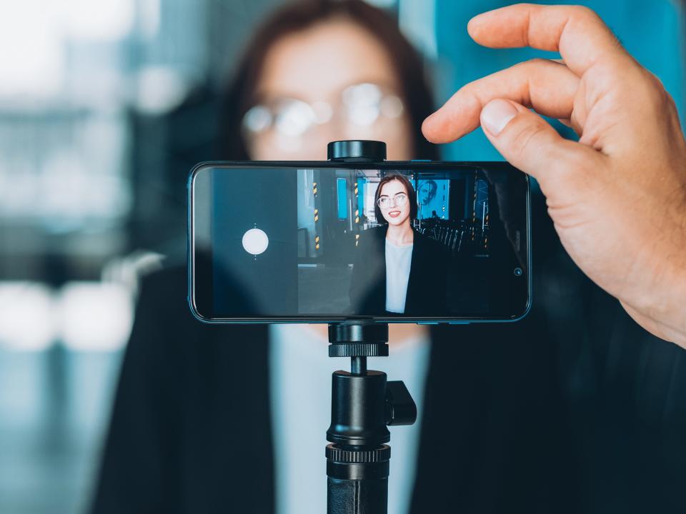 influencer assistant taking photo or video