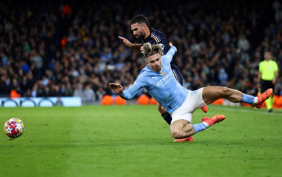 Dani Carvajal fouls Jack Grealish