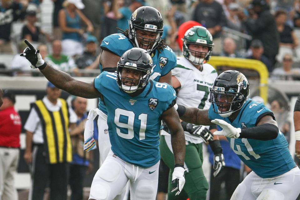 Jacksonville Jaguars defensive end Yannick Ngakoue (91) celebrates after sacking New York Jets quarterback Sam Darnold during the first half of an NFL football game, Sunday, Oct. 27, 2019, in Jacksonville, Fla. (AP Photo/Stephen B. Morton)