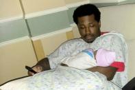 Rayshard Brooks, who was shot to death by former Atlanta Police Department officer Garrett Rolfe, holds his daughter in an undated photograph