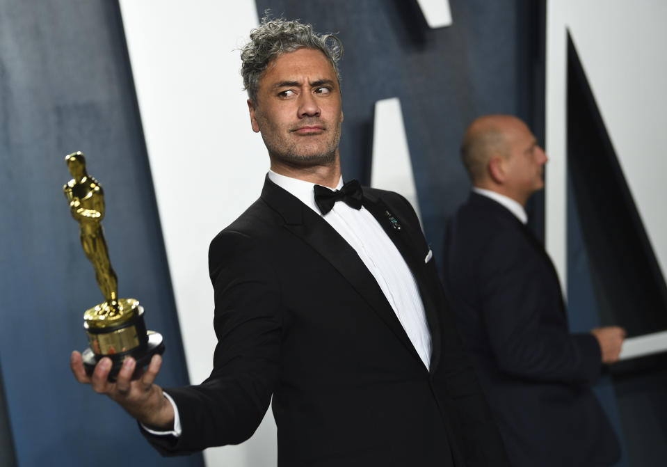 Taika Waititi, winner of the award for best adapted screenplay for "Jojo Rabbit," arrives at the Vanity Fair Oscar Party on Sunday, Feb. 9, 2020, in Beverly Hills, Calif. (Photo by Evan Agostini/Invision/AP)